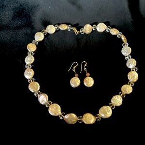 Pink beaded necklace and matching earrings.